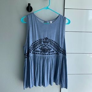 Tank top size XL. See through holes in design.